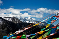 Prayer flags above 14000 foot mountain road pass