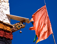 gargoyle and prayer flag