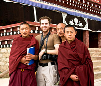 David and monks after him taking pictures using one of the monks memory card